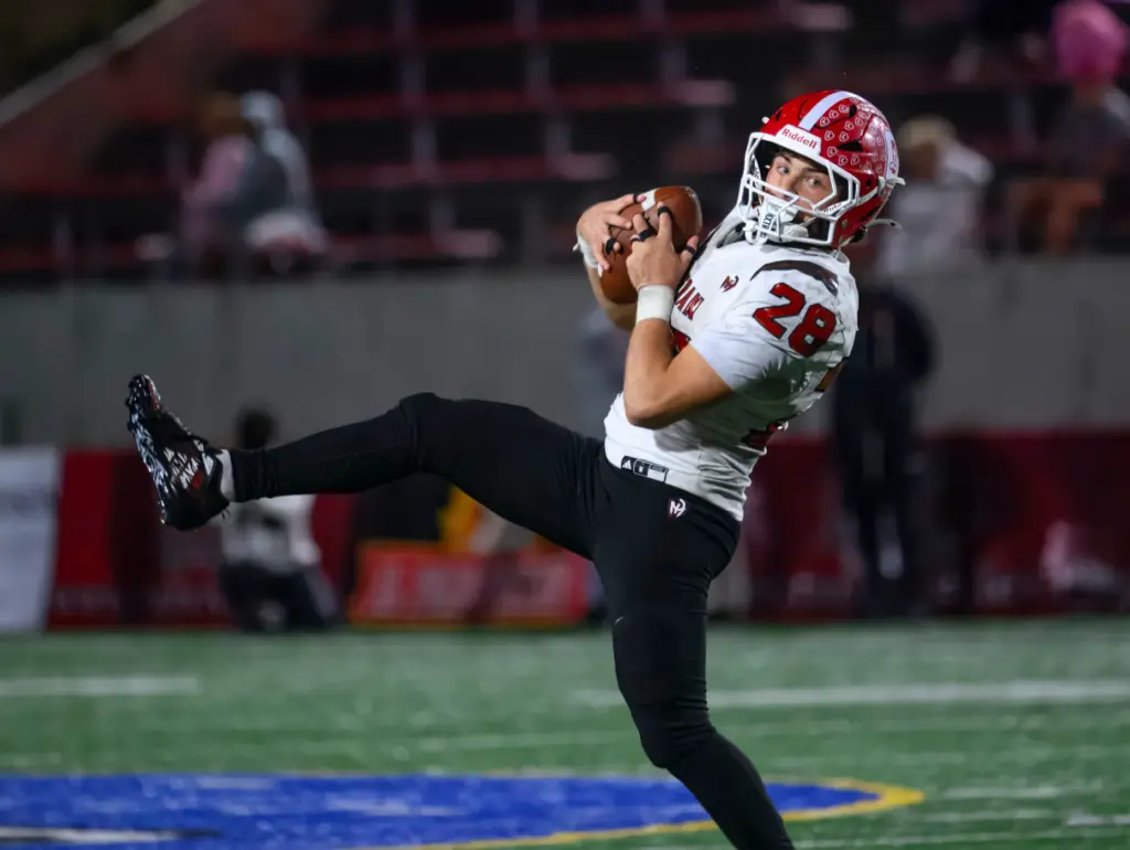 Orange Lutheran running back Ryan Christianson pulls in a pass...