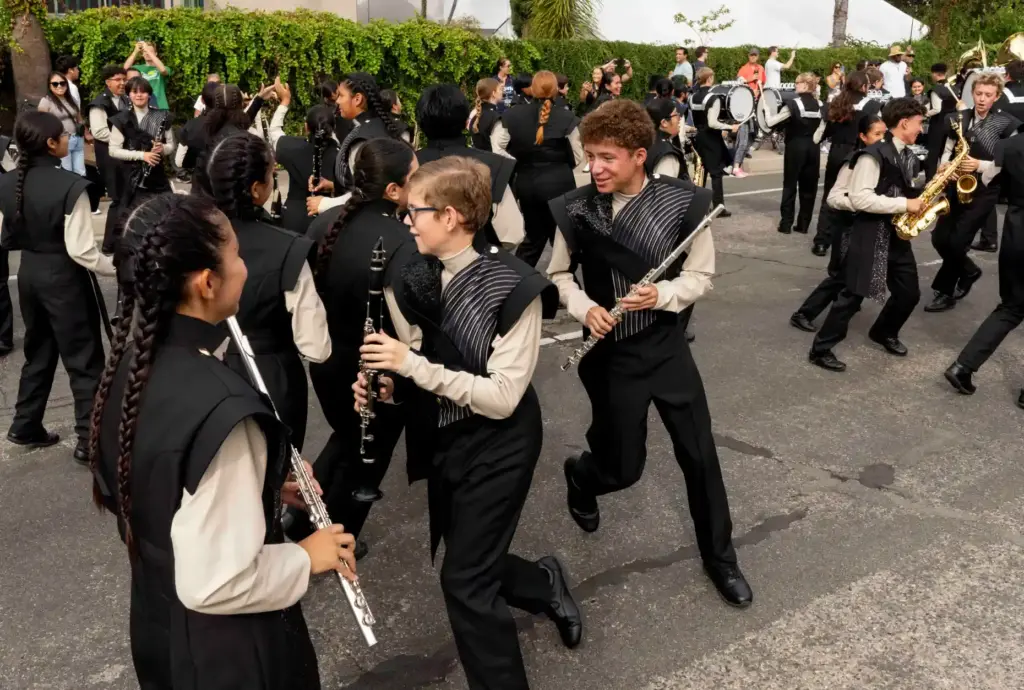 Woodwind players from El Dorado High Schoolâs marching band race...