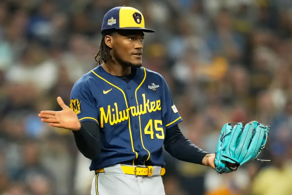 Milwaukee Brewers relief pitcher Abner Uribe celebrates the last out...