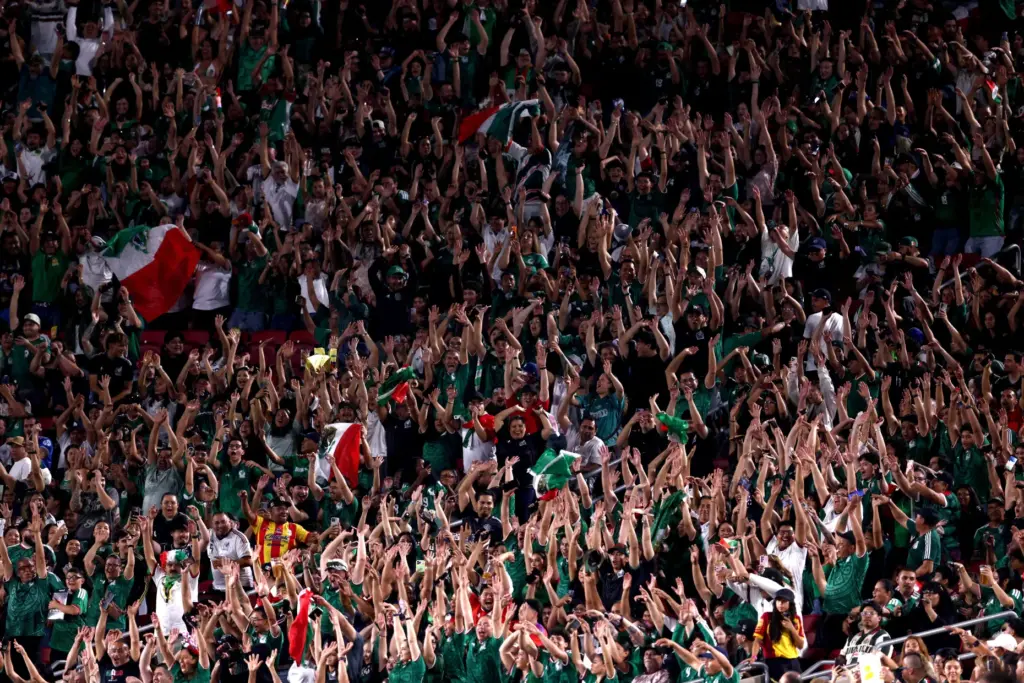 Mexico fans cheer during the first half of an exhibition...