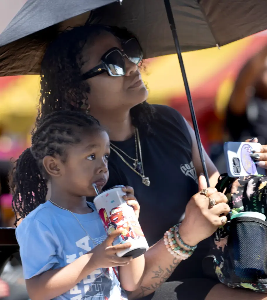 Mika Pegues and her 3-year-old son Samir watch Buena Park...