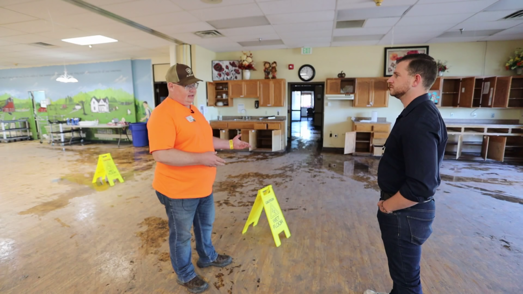 New Richland Care Center administrator Robert Johannsen examines the damaged nursing home.