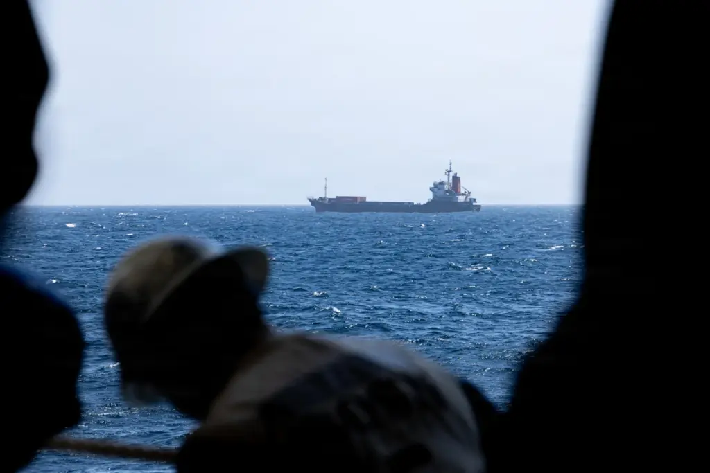 U.S. Marines from the 31st Marine Expeditionary Unit board M/V...