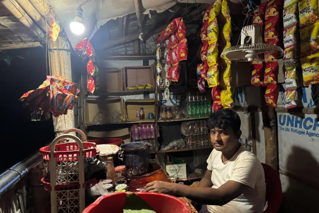 In this photo taken with a phone, Mohammed Hares keeps...