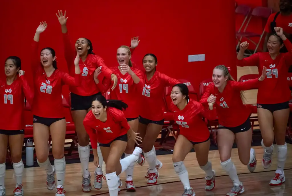 Mater Dei players run onto the court after the Monarchs...