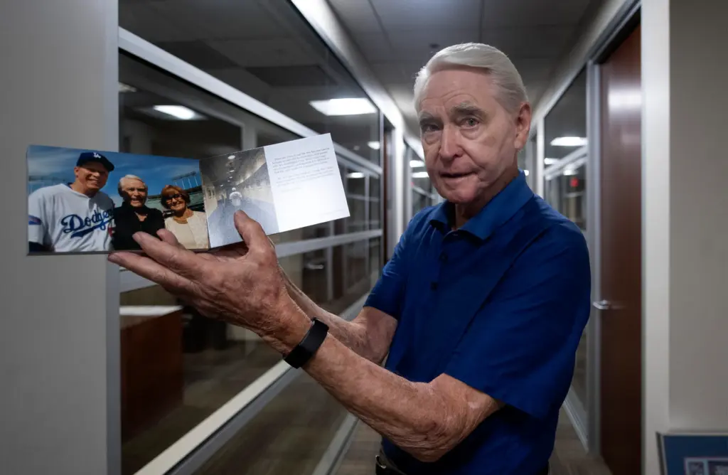 Fred Claire, a former Dodgers executive vice president, flips through...