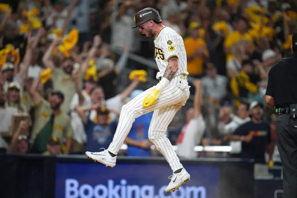 The San Diego Padres’ Jackson Merrill celebrates after scoring during...