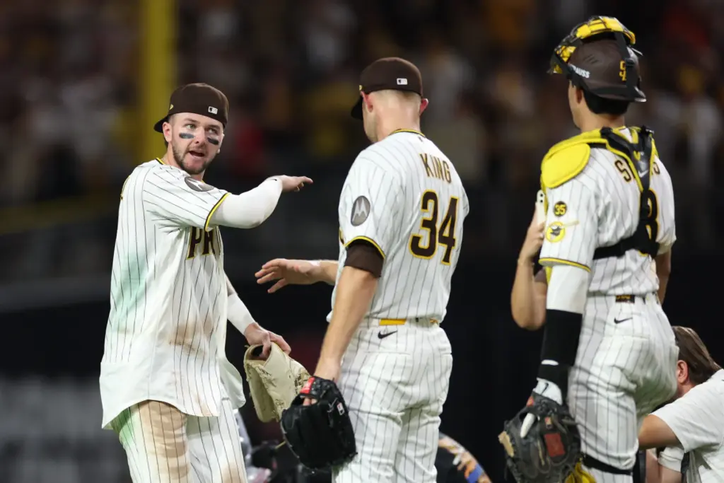 San Diego Padres outfielder Jackson Merrill, left, pitcher Michael King,...