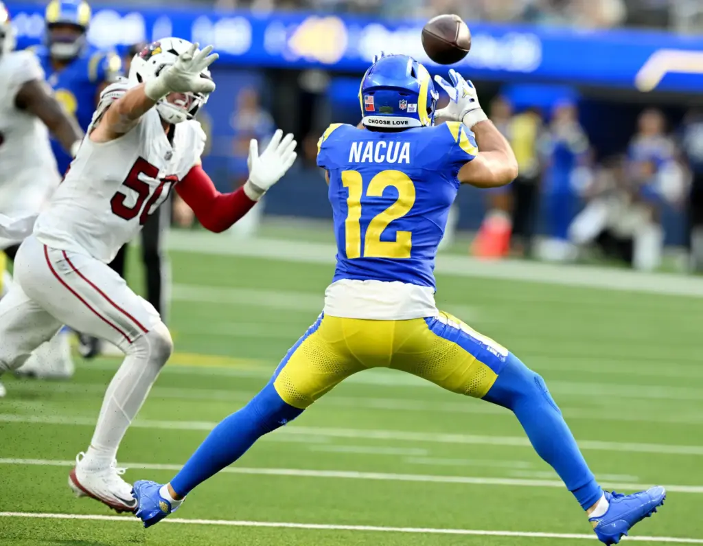 Rams wide receiver Puka Nacua (12) makes the first down...