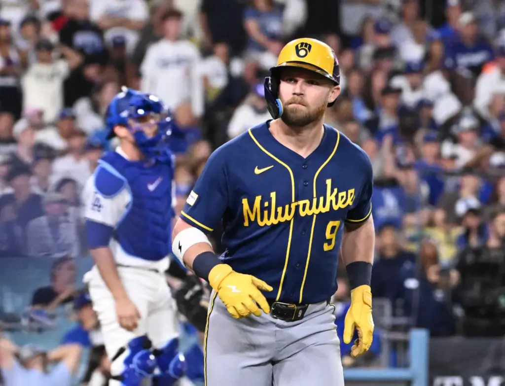 The Milwaukee Brewers’ Jake Bauers reacts toward his dugout after...
