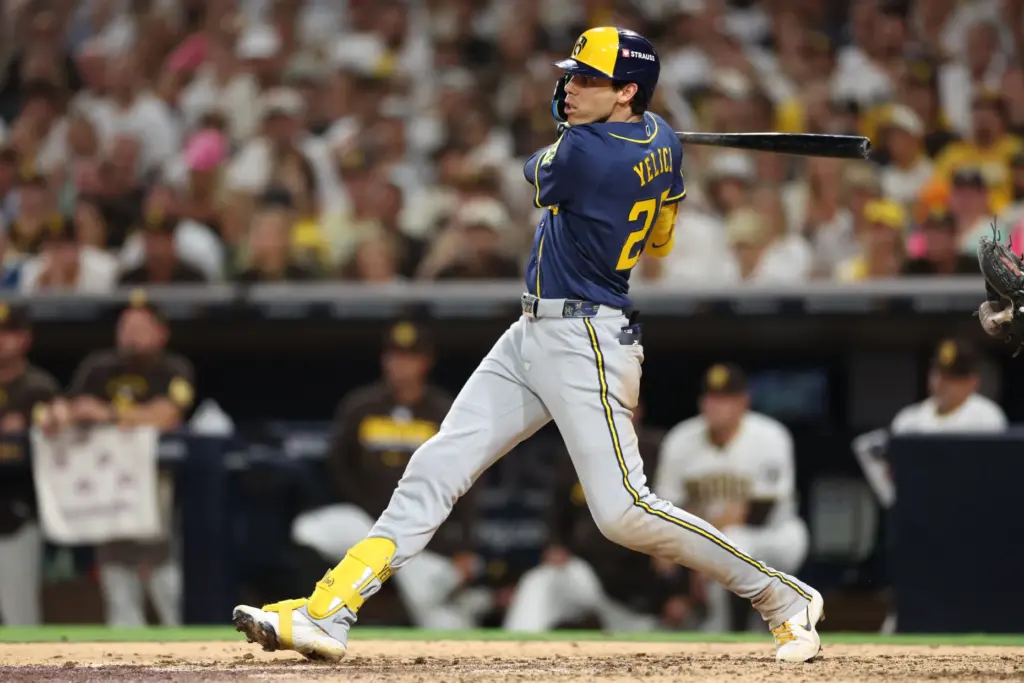 The Milwaukee Brewers’ Christian Yelich follows through on a RBI...