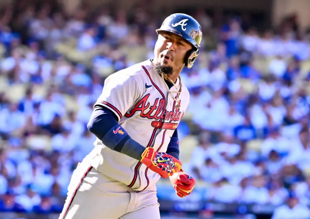 The Atlanta Braves’ Ozzie Albies looks to his dugout as...