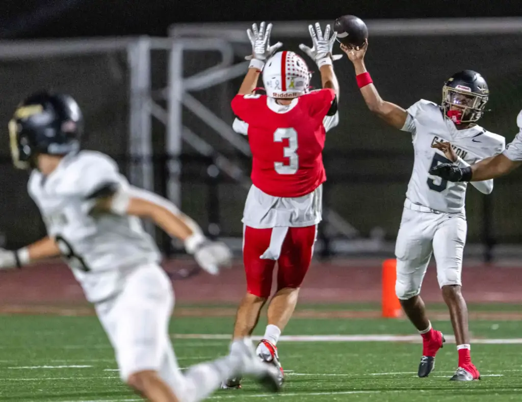 Canyon quarterback Kayden Phillips (5) throws the ball during a...