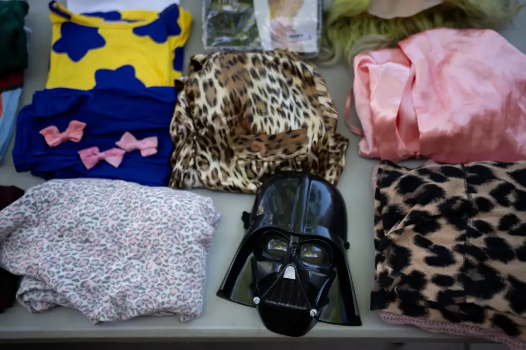 Halloween costumes and accessories are displayed during a Halloween costume...