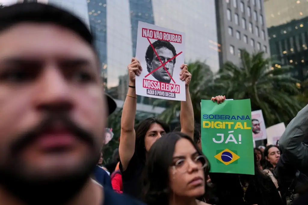 Demonstrators holding a banner that reads in Portuguese “Do not...