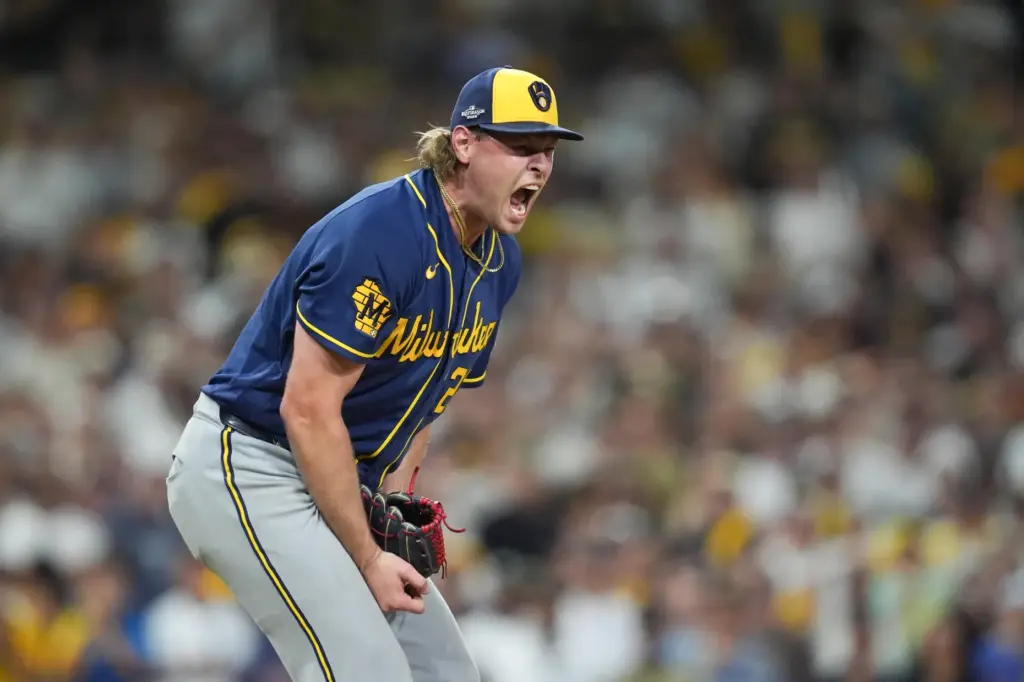 Milwaukee Brewers relief pitcher Trevor Megill celebrates after getting the...