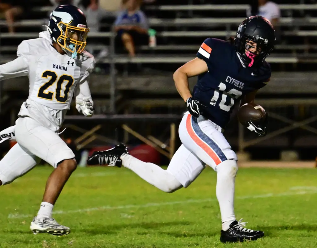 Matt Rodriguez #18 of Cypress catches a TD pass in...