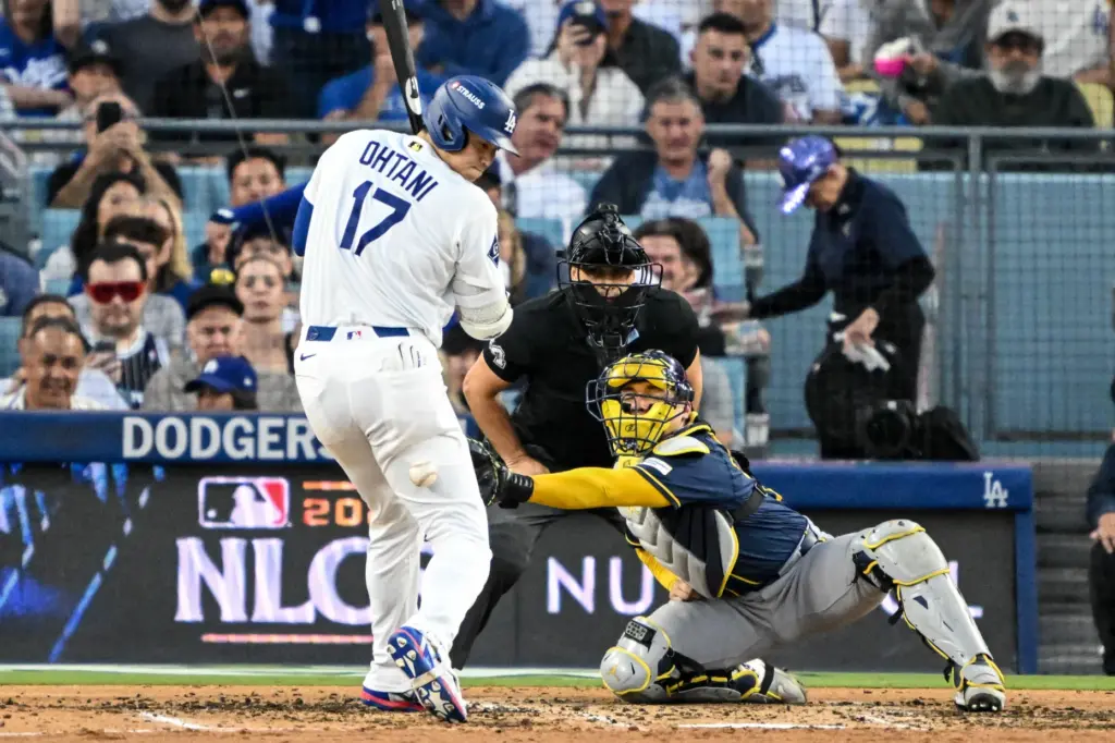 Dodgers star Shohei Ohtani gets hit with a wild pitch...