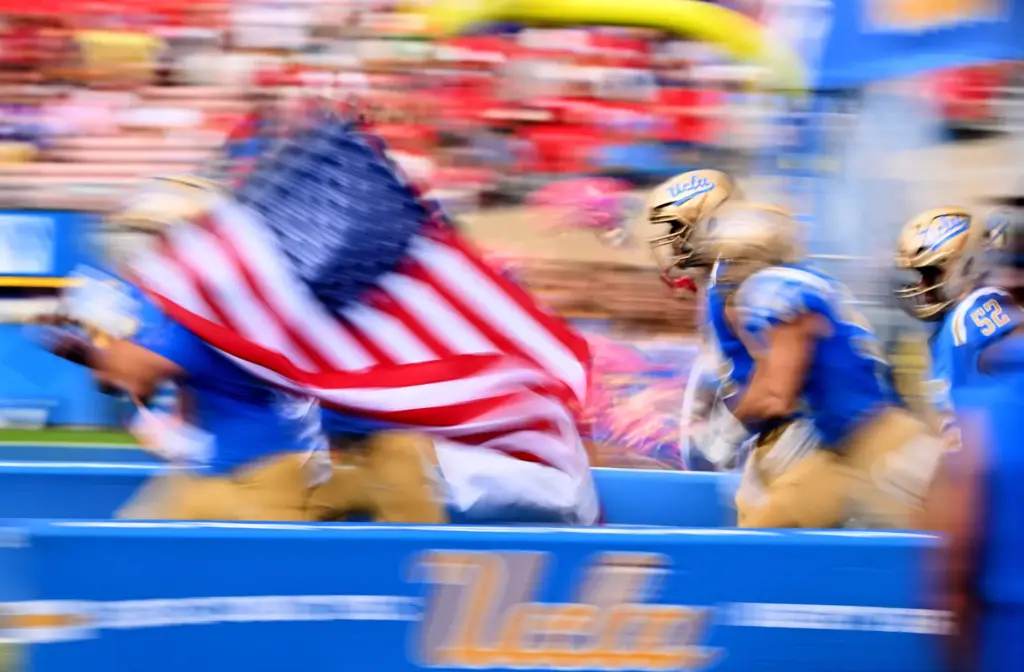UCLA Bruins runs onto the field prior to an NCAA...