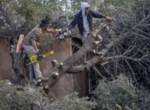 Flood warning lingers in Four Corners as soaked towns face sewage-tainted waters. 1 death reported