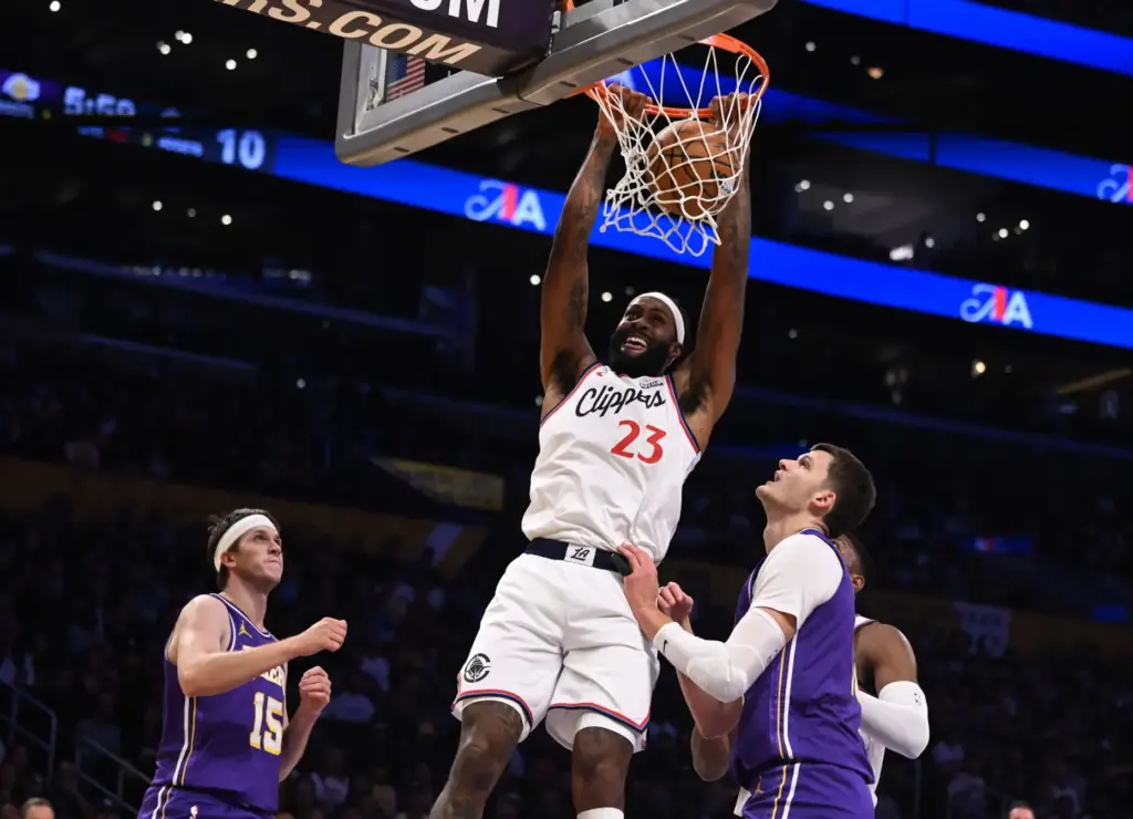 Clippers forward/center Isaiah Jackson dunks in front of Lakers center...
