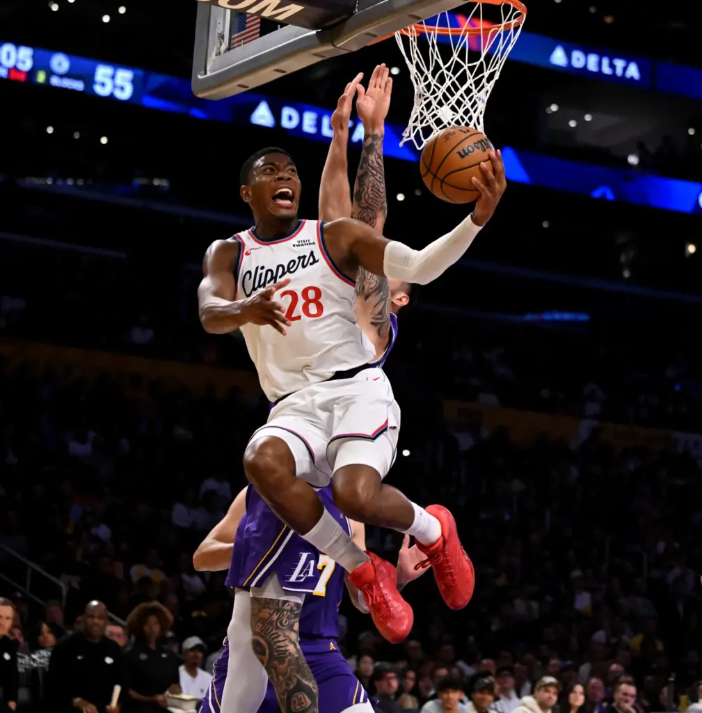 Clippers forward Rui Hachimura drives to the basket as Lakers...