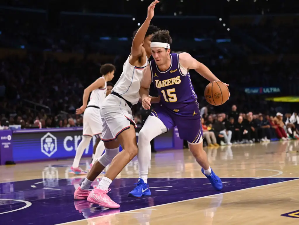 Lakers guard Austin Reaves drives to the basket during the...