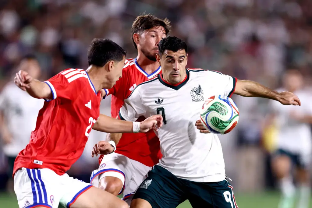 Mexico forward GermÃ¡n Berterame, right, vies for the ball during...