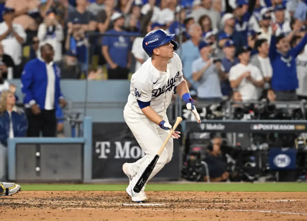 The Dodgers’ Will Smith watches the flight of his go-ahead...