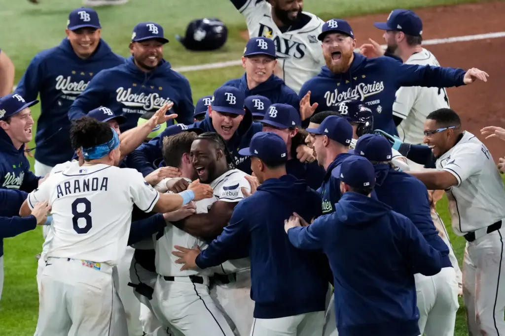 The Tampa Bay Rays mob teammate Ben Williamson to celebrate...