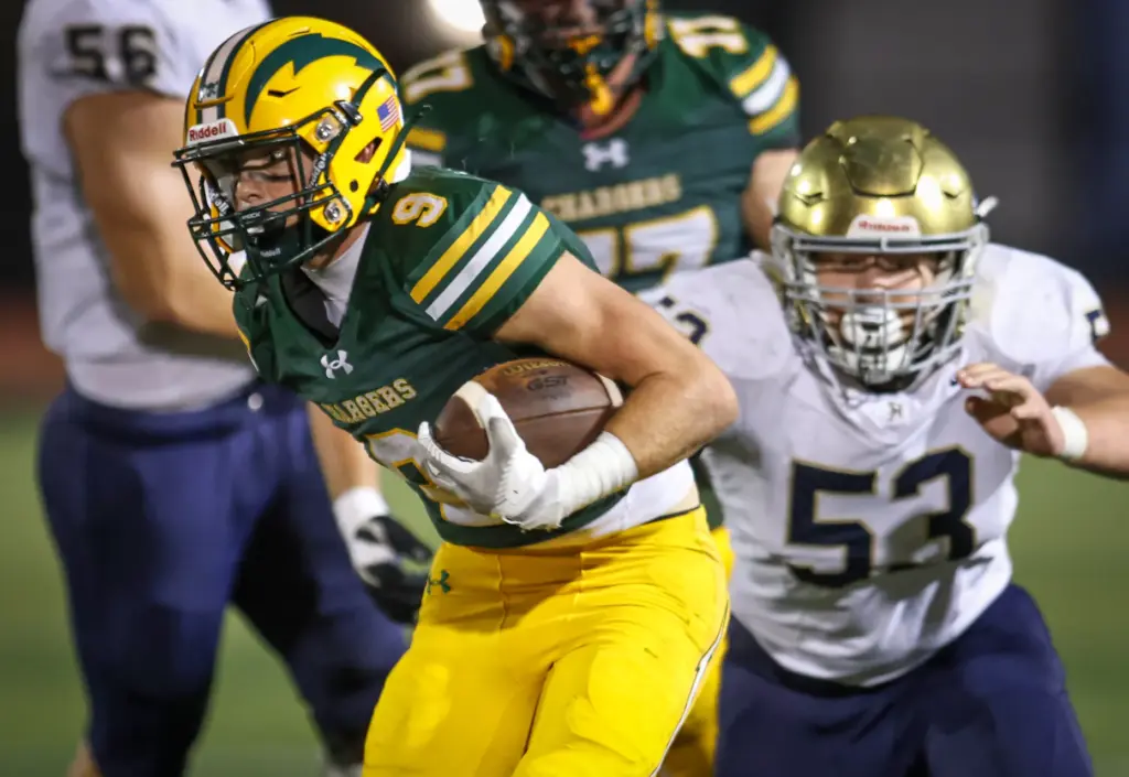 Edisonâs Samuel Edmisten, left, evades San Juan Hillsâ Winston Shuy,...