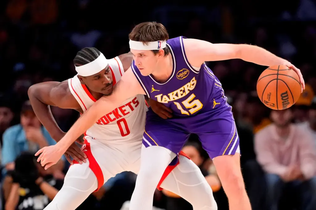 Lakers guard Austin Reaves handles the ball as Houston Rockets...