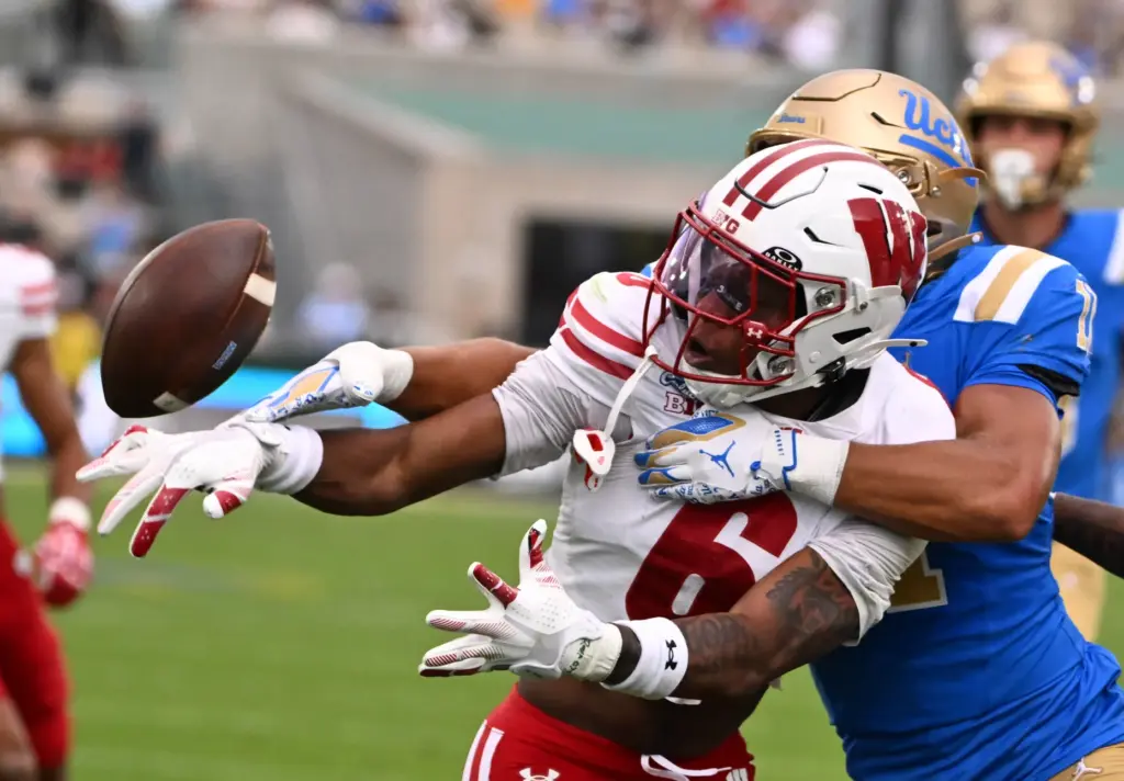 Cornerback Jai’mier Scott #6 of the Wisconsin Badgers knocks away...