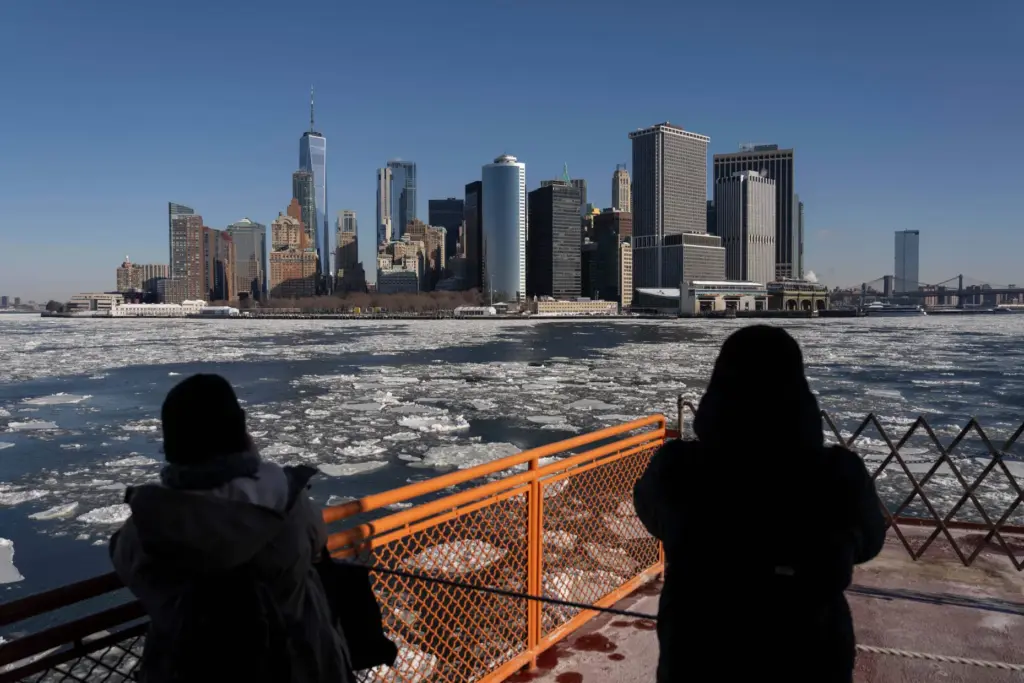 FILE – People take the Staten Island Ferry as ice...