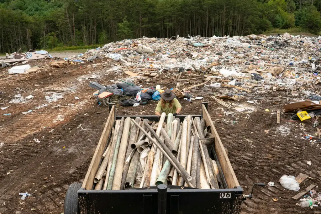 A worker from MountainTrue brings IPEX PVC pipe to the...