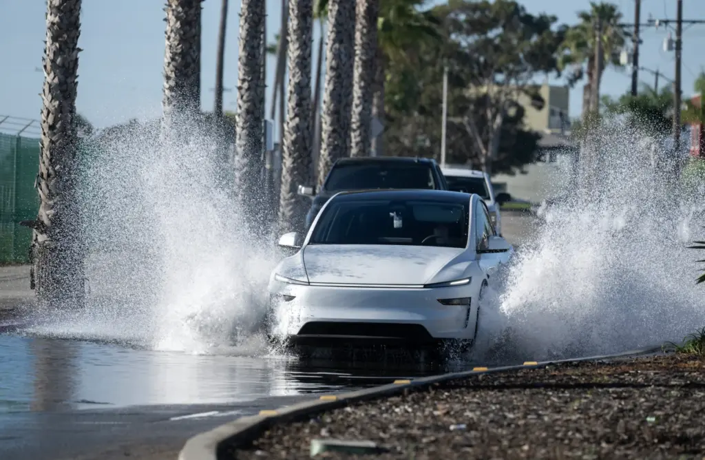 Cars push through flooding on Seal Beach Blvd. near PCH...