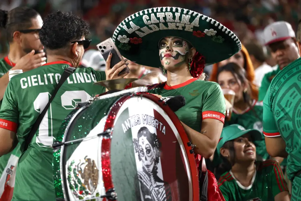 A Mexico supporter looks on before an exhibition match against...