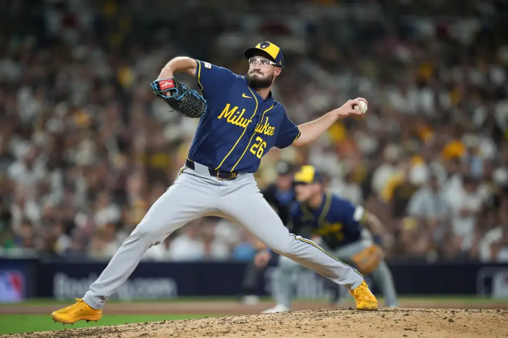 Milwaukee Brewers relief pitcher Aaron Ashby throws to the plate...