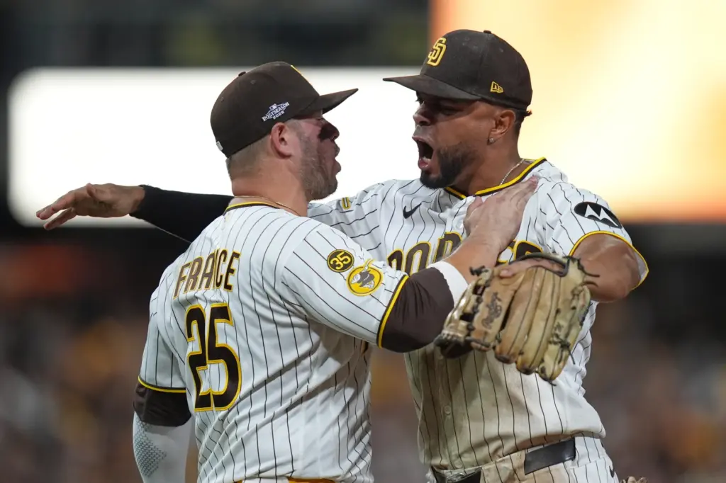 The San Diego Padres’ Xander Bogaerts, right, and Ty France...