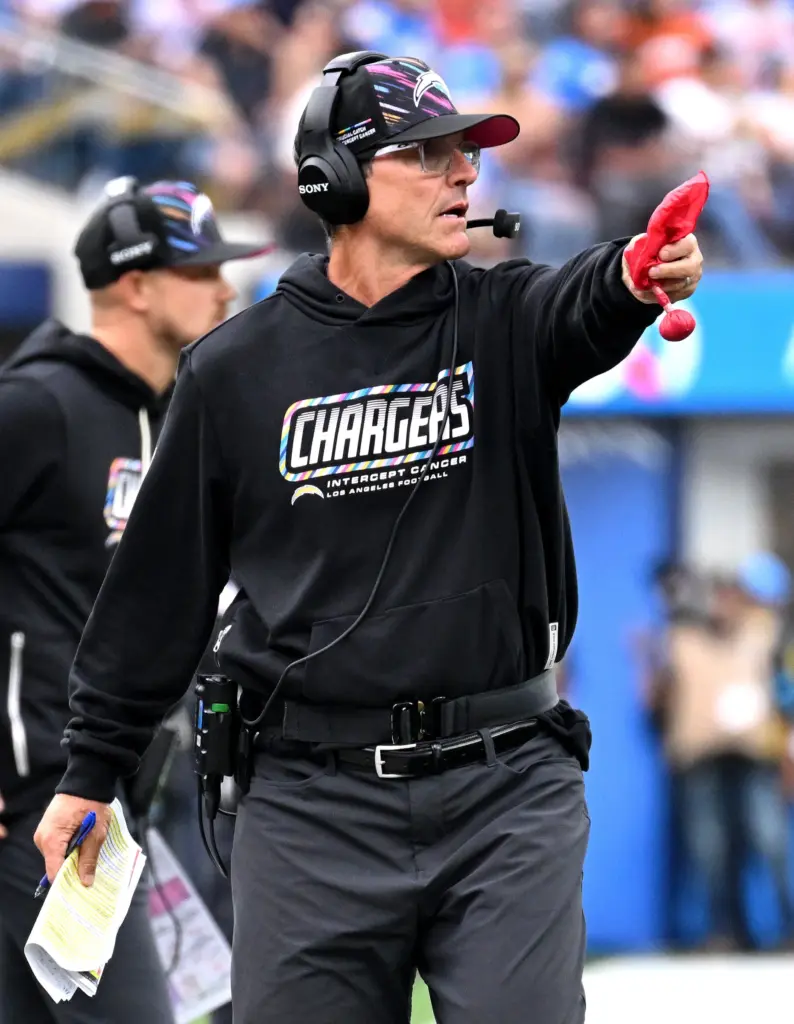 Chargers head coach Jim Harbaugh drops the challenge during the...