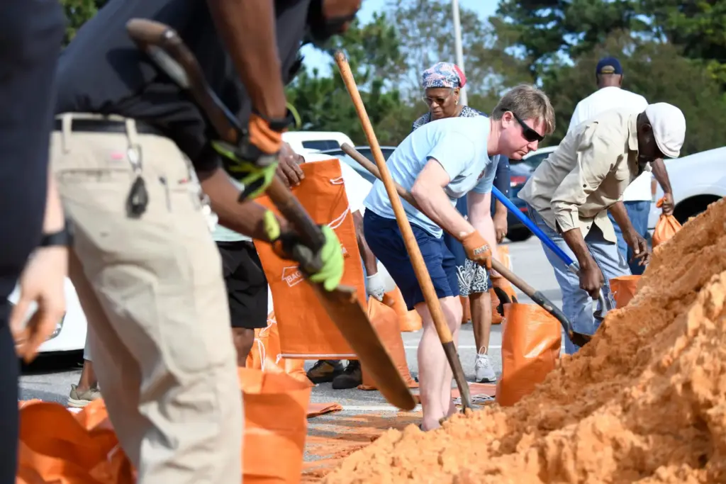 Residents pick up sandbags at the James Seals Jr. Parks...