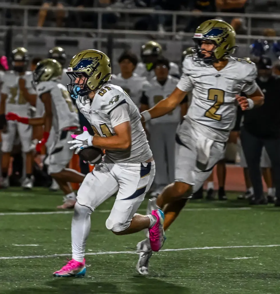 El Segundo running back Rocco Taylor rushes with the ball...