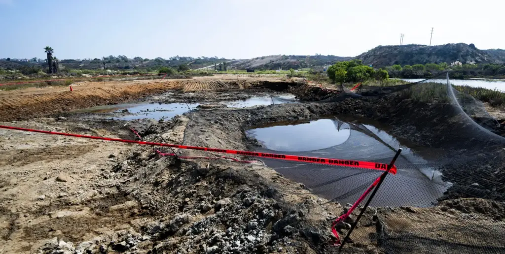 Areas of contaminated soil are being cleaned up at the...