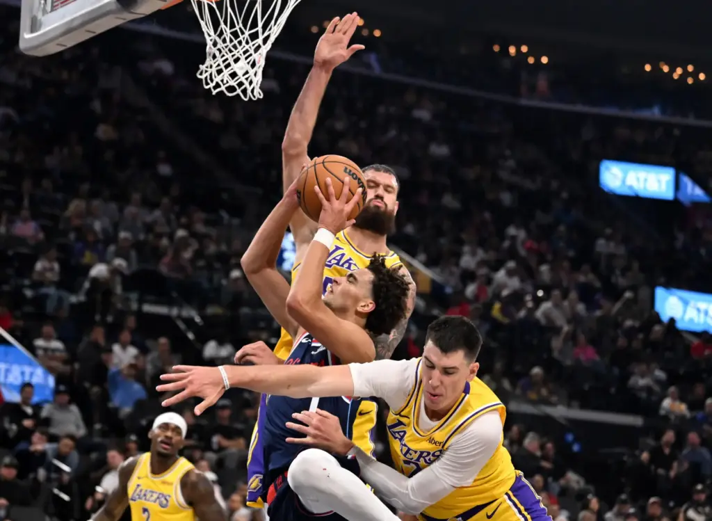 Clippers guard Keaton Wagler is fouled by Lakers forward Jake...