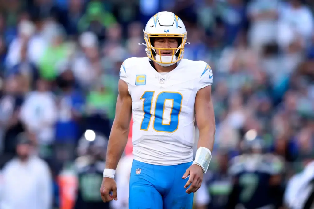 Chargers quarterback Justin Herbert reacts during the second half of...