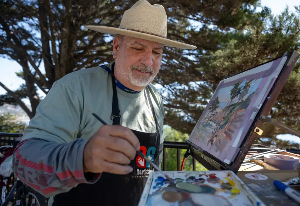 Artist Anthony Salvo uses earth tones to create his painting...