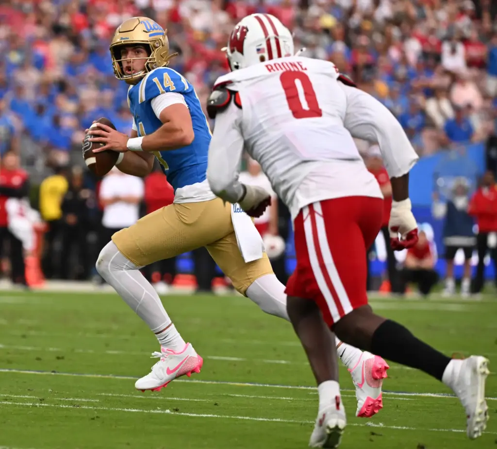 Quarterback Ty Dieffenbach #14 of the UCLA Bruins passes against...