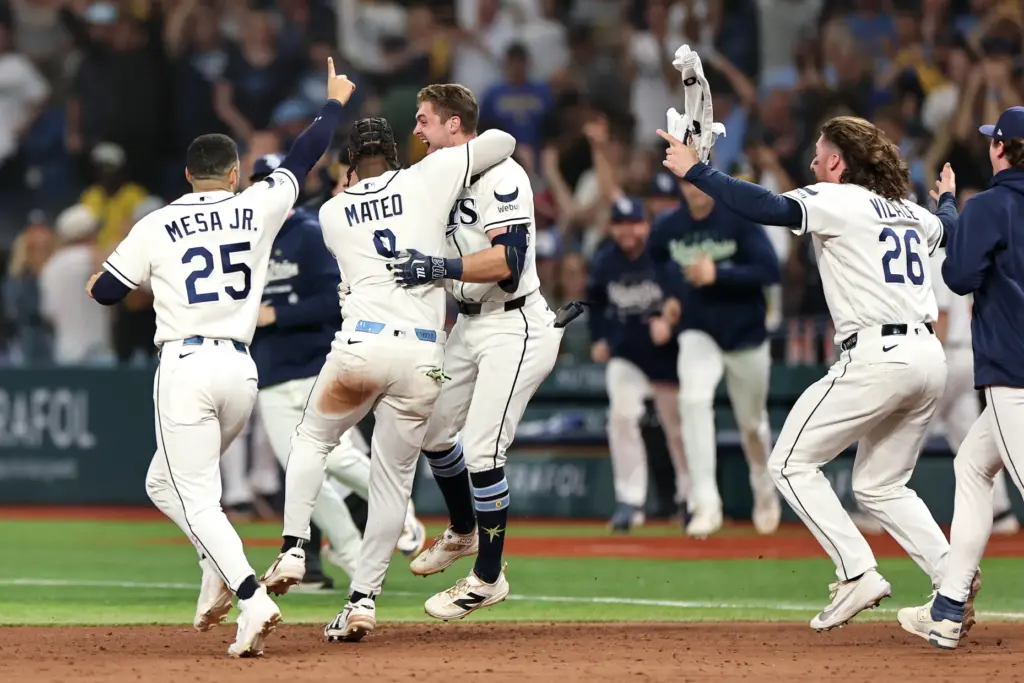 The Tampa Bay Rays celebrate with Ben Williamson (15) after...