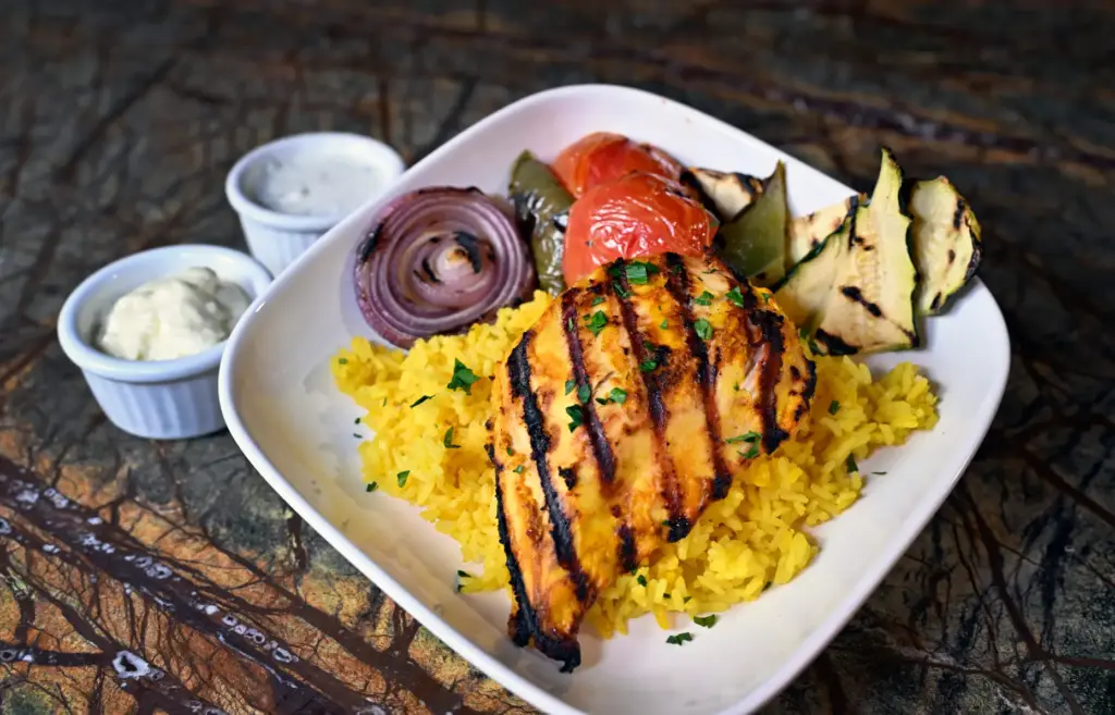 Mediterranean Bowl, includes yogurt-marinated grilled chicken, turmeric rice, roasted bell...