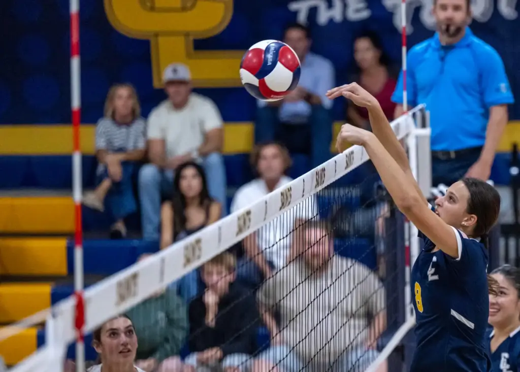 Crean Lutheran middle blocker Liberty Badorek (8) blocks the ball...